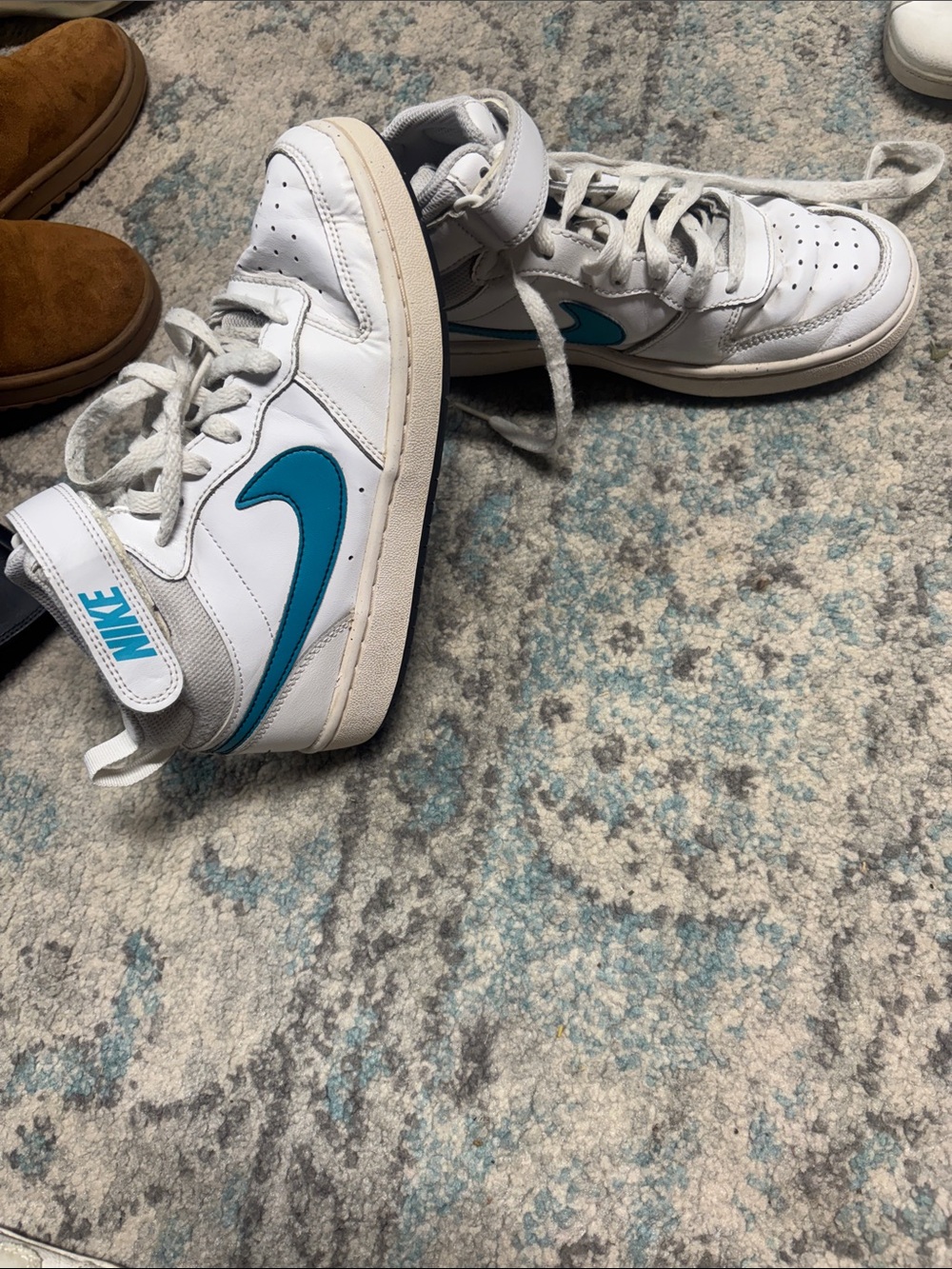 Nike White High-Top Sneakers with Teal Swoosh